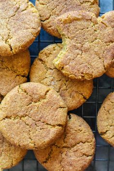 a bunch of cookies that are sitting on a cooling rack in front of the camera