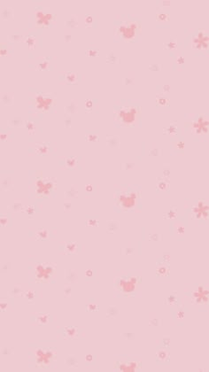 a pink wallpaper with mickey mouse heads on it's side and stars in the background