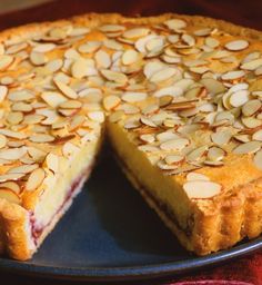 a pie with almonds is on a plate