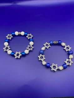 Beautiful silver Star of David bracelet with royal blue and white stone beads. A real statement honoring Israel and the Jewish faith. Small Bracelets, Star Of David, Bat Mitzvah, White Stone, Silver Stars, Bead Bracelet, Stone Beads, Royal Blue, Jewelry Bracelets