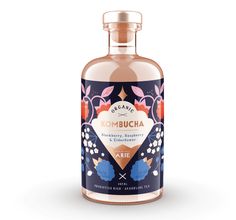 a bottle of kombucha gin on a white background with an orange and blue design