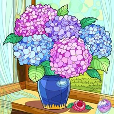 a vase filled with purple and blue flowers