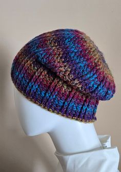 One of a kind, hand crocheted, adult sized, LoLo Beanie! Warm & cozy, beautiful colored ombre shades with long striping sequences of Aquamarine, Turquoise, Ultra Violet, Cherry Red, and Mustard Yellow.   My inspiration started with a pattern I found for an amazing cowl.  I wanted a coordinating beanie, but couldn't find one, so I made this one and I love it!  I especially like the top which has a medallion/mandala center.  It's just the slightest bit "slouchy" and "stretch" so there is no ribbed Hand Knitted Multicolor Crochet Hat In Cotton Yarn, Multicolor Hand Knitted Crochet Cotton Hat, Colorful Yarn Crochet Hat, Multicolor Knitted Crochet Hat In Cotton, Handmade Bohemian Crochet Hat In Acrylic Yarn, Colorful Crochet Yarn Hat, Hand Knitted Multicolor Crochet Hat In Yarn, Multicolor Hand Knitted Crochet Hat, Hand Knitted Multicolor Crochet Hat