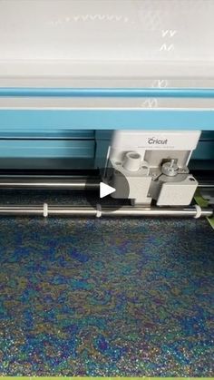 an image of a machine that is cutting fabric on the floor with it's blades