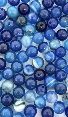 blue and white glass beads are on display