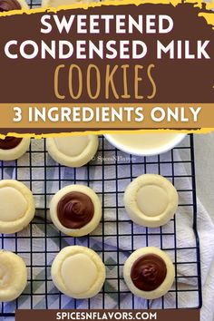 some cookies are on a cooling rack with chocolate and peanut butter in the middle,