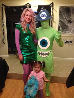 a woman and child are dressed up as monsters