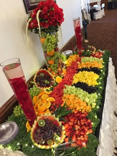 a table topped with lots of fruit and flowers