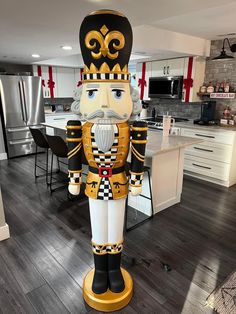 an inflatable nutcracker stands in the middle of a kitchen with hardwood floors