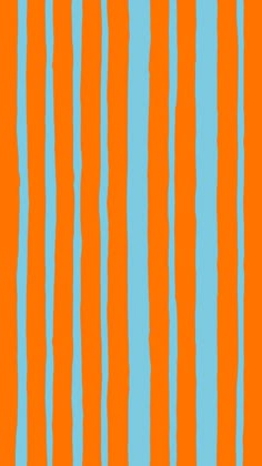 an orange and blue striped wallpaper with vertical lines on the bottom half of it