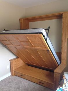 a bed that has been opened and is sitting in the middle of an empty room