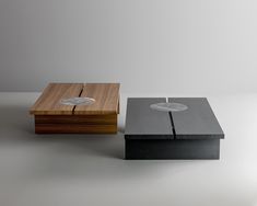 two wooden and metal boxes sitting on top of each other