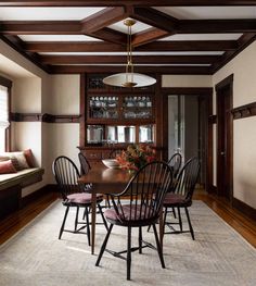 the dining room table is surrounded by chairs and other furniture, along with an area rug on the floor