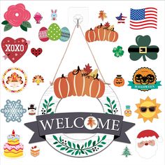 the welcome sign is surrounded by many different decorations and symbols, such as pumpkins