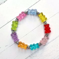 These gummy bears look good enough to eat. Exact replicas of real gummy bears in size, and the details of the face is impeccable. You'll feel so fun when wearing it. Great for any person of any age. After all, who doesn't love gummy bears! Each bracelet measures 6 1/2 inches around inside and is strung on high quality stretch material, double stranded for strength. Please let me know if you would like it in a different size, there's no extra charge. All items are made upon ordering so they can be customized to you. [Note: This is an original design] Is this a gift? Have it sent directly to them for a wonderful surprise, and gift wrapping is happily available. Let me know if you would like a note included. New and exciting jewelry is added all the time. Custom jewelry is also available.... Gummy Bear, Gummy Bears, Acrylic Beads, Stretch Bracelet, Stretch Bracelets, Custom Jewelry, Original Design, The Face, Make Your Own