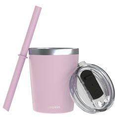 a pink cup with a straw and lid next to it