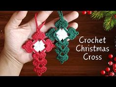 two crocheted christmas ornaments hanging from a tree