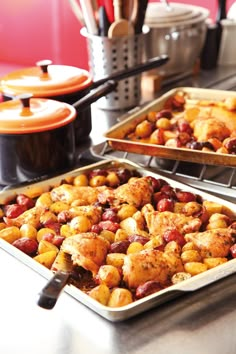 two pans filled with food sitting on top of a counter