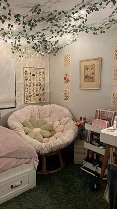 a bedroom with two beds and lots of pictures on the wall above them, along with other furniture