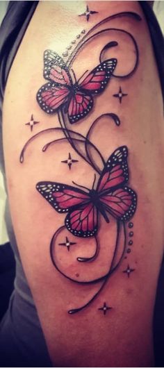 a woman's thigh with butterflies on it and stars in the sky behind her