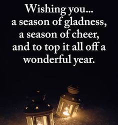 two lit lanterns with the words wishing you a season of gladness, a season of cheer, and to top it all off a wonderful year