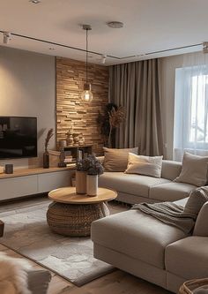 a living room filled with furniture and a flat screen tv on top of a wooden table