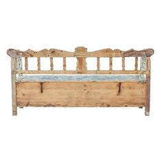 an old wooden bed frame with two drawers