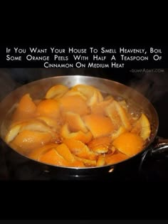 a pan filled with orange peels on top of a stove