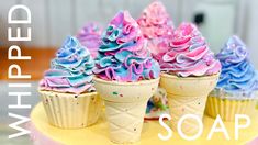 three ice cream cones with sprinkles on top of each one and the words whipped