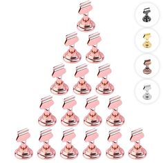 a christmas tree made out of pink and gold metal pieces with different knobs on each side