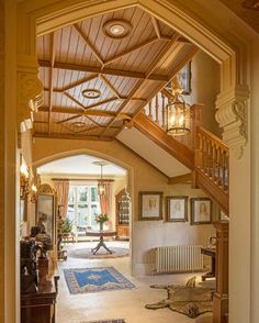 an entry way leading to a living room and dining room