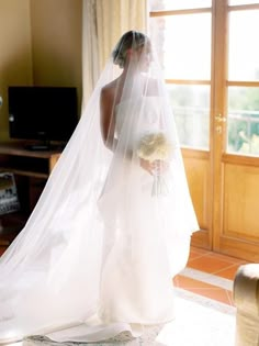 a woman in a wedding dress and veil