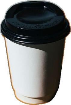 a black and white coffee cup sitting on top of a table