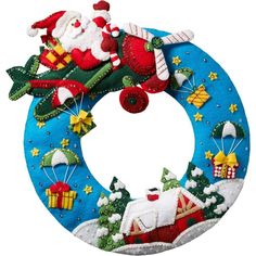 a christmas wreath with santa claus and other decorations