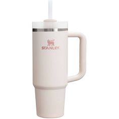 a white travel mug with a straw sticking out of it's top and the word stanley on the side