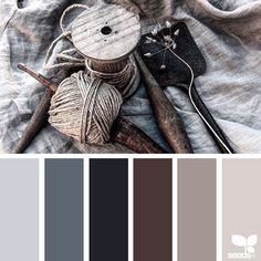 the color scheme is gray, brown, and white with some knitting supplies on it