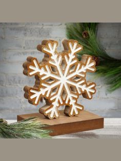 a wooden snowflake on top of a table