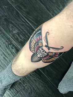 a person with a tattoo on their leg