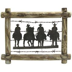 the silhouettes of three cowboys on horseback are mounted in a rustic wooden frame with barbed wire