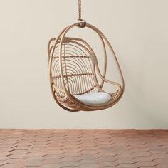 On a neutral background is a natural rattan egg shaped hanging chair with an ivory cushion and rope details. Rattan Hanging Chair, Outdoor Hanging Chair, Hanging Rattan Chair, Rattan Planters, Hanging Rattan, Hanging Chair Outdoor, Rattan Chairs, Rattan Outdoor, Woven Furniture