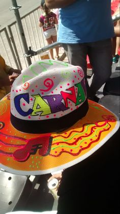 a colorful hat with the word camp on it