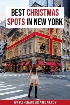 a woman standing in front of a building with the words best christmas spots in new york