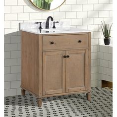 a bathroom vanity with a mirror above it and tiled flooring in front of the sink