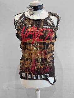 "THE STITCHES Distressed Rock collection - This Slayer tee is a handmade bleached crop top/t-shirt made with a brand new officially licensed band shirt. - Distressed Slayer crop top/shirt - Bespoke safety pin unisex hand-made crop/tee - Material: Bleached cotton Measurements: - One Size - Width (armpit to armpit) 18\" - Length (top of collar to bottom) 25\" - Stretchy T-shirt: Fit UK 8-12, US4-8 Care instructions: - This is a distressed item and will require proper care, it should be washed insi Safety Pin Shirt Ideas, Distressed Rock T-shirt For Streetwear, Distressed Punk T-shirt, Edgy Acid Wash T-shirt For Alternative Fashion, Edgy Acid Wash Bleached T-shirt, Distressed Rock T-shirt For Concerts, Acid Wash Distressed Punk Tops, Punk Distressed T-shirt For Festivals, Distressed Acid Wash Punk Tops