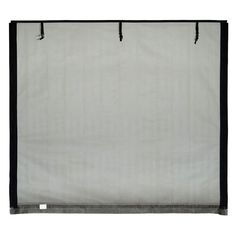 a white and black curtain hanging on a wall