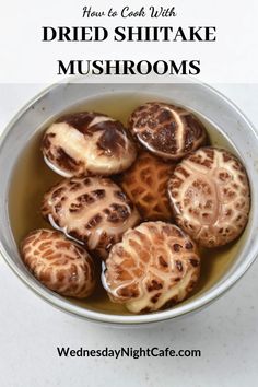 a bowl filled with sliced mushrooms on top of a table