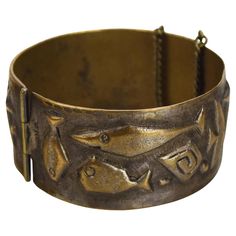 This beautiful handcrafted bronze hinged bangle or bracelet showcases a striking mid-century modernist fish pattern, signed by the artist Korosanyi. The detailed embossing of stylized fish motifs and star-like forms lends a unique, artistic flair, evoking a sense of underwater movement and elegance. Inner Width (max.): Approximately 6.2 cm / 2.44 inches Height: Approximately 3 cm / 1.18 inches Weight: Approximately 62 grams Condition: This bangle is in excellent, nearly mint condition with minim Line Vautrin, Ornaments Jewelry, Fish Motif, Fish Pattern, Bronze Jewelry, Fish Patterns, Bronze Metal, Hinged Bangle, Metal Bracelets