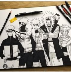 a drawing of some anime characters with pencils on the table next to them and two markers