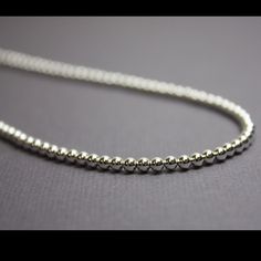 A Pretty Glistening Sterling Silver Bead Necklace. This Necklace Features A Single Strand Of Small 3mm Sterling Silver Beads. The Necklace Could Be Layered With Others Or Worn Alone. Sparkly, Small And Delicate, It Would Make A Wonderful Addition To Any Wardrobe. The Single Strand Necklace Will Be Made To Order And Is Available In 13" To 24” Inches Lengths. I Hand String These Sterling Silver Beads On Beading Wire And Finish Them With A Sterling Silver Lobster Clasp And Ring. This Listing Price Silver Single Strand Everyday Beaded Necklace, Everyday Necklace With Spacer And Round Beads, Classic Beaded Necklaces With Round Beads For Everyday, Classic Beaded Necklaces With Round Beads, Everyday Round Beads Necklace With Spacer Beads, Classic Silver Beaded Necklaces As Gift, Everyday Silver Necklace With Polished Beads, Minimalist Silver Beaded Necklace, Everyday Beaded Necklaces With Round Ball Chain