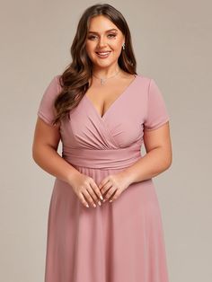 Embrace your curves and feel like a queen in this stunning Plus Size Pleated V-Neck Short Sleeves Empire Waist A-Line Bridesmaid Dress. The pleated details, V-neckline, and empire waist create a flattering and feminine silhouette, making it the perfect choice for bridesmaids or formal events. Shine alongside the bride and complement the wedding ambiance with this elegant and comfortable dress. Fit: Please refer to size chart. Length: Floor length. Sleeve Style: Short sleeves. Closure: It is conc Pink V-neck Bridesmaid Dress, Fitted V-neck Bridesmaid Dress, Medevil Dresses, Quincenera Dresses, Dresses Revolve, Unusual Dresses, Wedding Ambiance, Long Dress Plus Size, Summer Bridesmaid Dresses